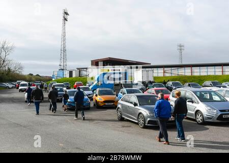 Weymouth, Dorset, UK.  14th March 2020.  Fans arriving for the Weymouth FC v Slough Town Vanarama National League South match at the Bob Lucas Stadium ahead of the 3pm kickoff.  Most National league football is still playing this weekend despite the Premier League and EFL shutting down due to the coronavirus.  Picture Credit: Graham Hunt/Alamy Live News Stock Photo