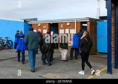 Weymouth, Dorset, UK.  14th March 2020.  Fans arriving for the Weymouth FC v Slough Town Vanarama National League South match at the Bob Lucas Stadium ahead of the 3pm kickoff.  Most National league football is still playing this weekend despite the Premier League and EFL shutting down due to the coronavirus.  Picture Credit: Graham Hunt/Alamy Live News Stock Photo