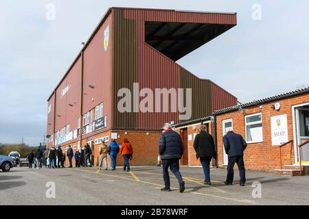 Weymouth, Dorset, UK.  14th March 2020.  Fans arriving for the Weymouth FC v Slough Town Vanarama National League South match at the Bob Lucas Stadium ahead of the 3pm kickoff.  Most National league football is still playing this weekend despite the Premier League and EFL shutting down due to the coronavirus.  Picture Credit: Graham Hunt/Alamy Live News Stock Photo