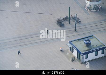 Berlin, Germany. 13th Mar, 2020. Few people cross the Alexanderplatz. Credit: Annette Riedl/dpa-Zentralbild/ZB/dpa/Alamy Live News Stock Photo