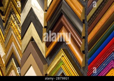 Craftsman working on frame in frame shop. Professional framer hand holding frame angle Stock Photo