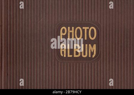 Top view of an old photograph scrapbook album with a tied string