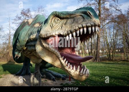 LUBIN, POLAND - DECEMBER 11, 2017 - Realistic model of dinosaur Tyranosaurus Rex in Park Wroclawski. Park is well known tourist attraction for childre Stock Photo