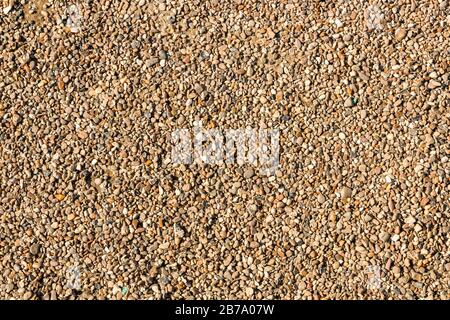 a lot of small brown and grey pebble stones for background design Stock Photo