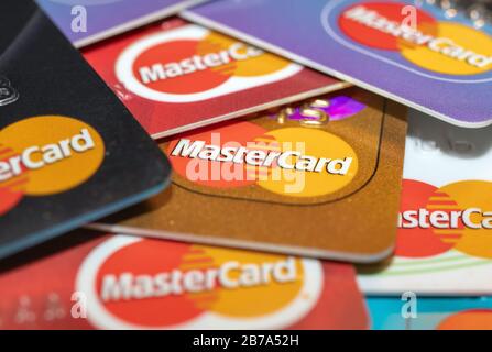 London / UK - March 6th 2020  - Pile of Mastercard bank cards, closeup macro view with a shallow depth of field Stock Photo