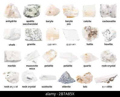 set of various unpolished white stones with names ( granite, gypsum, petalite, baryte, howlite,, rock-crystal, marble, carbonatite, chalk, anhydrite, Stock Photo