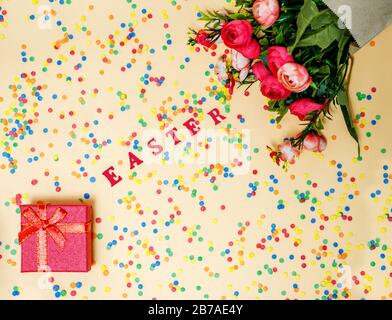Festive Easter card with a bouquet of roses and a red box Stock Photo