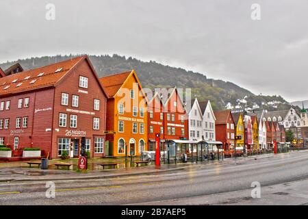 View of Bryggen on summer rainy day ,Bergen,Norway.A medieval wharf in the historic harbour district known for its colourful, wooden-clad boat houses. Stock Photo