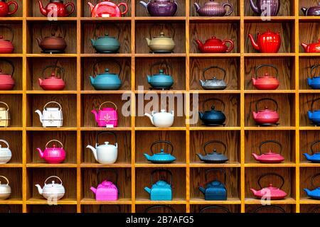 Iron cast teapots (tetsubin) an a wooden shelf at Mariage Frères Tea  Emporium and Restaurant, Covent Garden, London, UK Stock Photo - Alamy