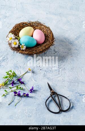 Three Easter eggs on delicate blue background Stock Photo