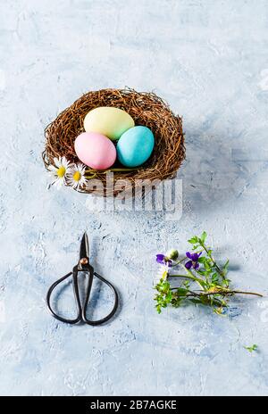 Three Easter eggs on delicate blue background Stock Photo