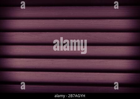Close-up texture of wooden blinds in violet color. Natural wooden background. Photo with vignetting Stock Photo
