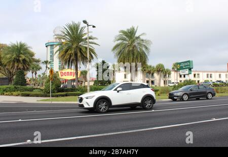 February 20, 2020- Orlando, Florida: Passing by a Denny's restaurant and La Quinta hotel chain Stock Photo