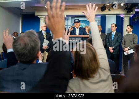Washington, United States Of America. 14th Mar, 2020. Washington, United States of America. 14 March, 2020. U.S President Donald Trump, joined by Vice President Mike Pence and members of the White House Coronavirus Task Force, take questions from the press at a coronavirus update briefing in the Briefing Room of the White House March 14, 2020 in Washington, DC. Credit: Shealah Craighead/White House Photo/Alamy Live News Stock Photo
