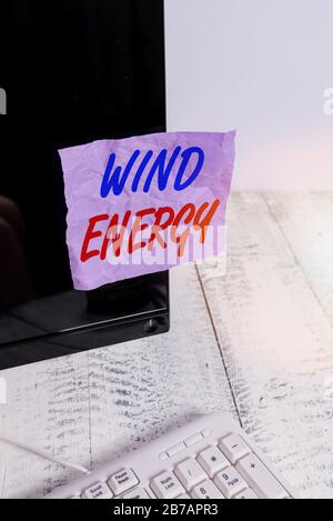 Conceptual hand writing showing Wind Energy. Concept meaning the process by which wind is used to generate electricity Notation paper computer monitor Stock Photo