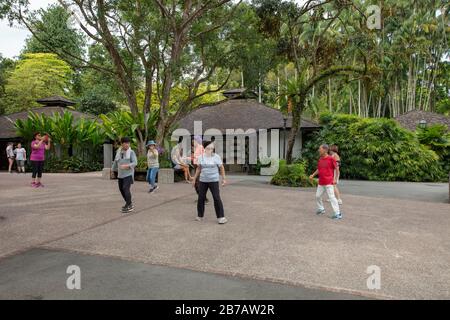 Group of senior citizens seen in a dance exercise class in Singapore Botanic Gardens. Stock Photo