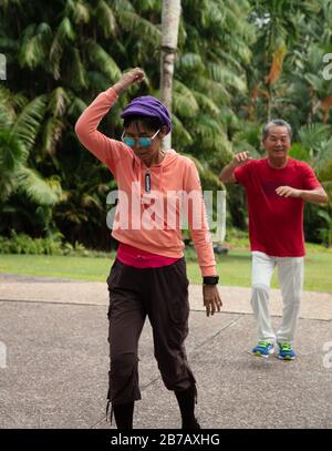 Group of senior citizens seen in a dance exercise class in Singapore Botanic Gardens. Stock Photo