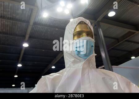 Mannequin with a protective mask and anti-chemical and antibacterial equipment. Medicine and Research Stock Photo