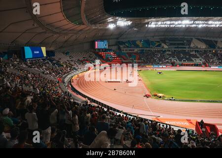 Crowds of spectators watch events at the IAAF World Athletic Championships 2019 at Khalifa International Stadium, Doha, Qatar Stock Photo