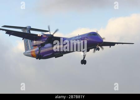 A De Havilland Bombardier operated by Flybe, making a final approach at Leeds Bradford International Airport Stock Photo