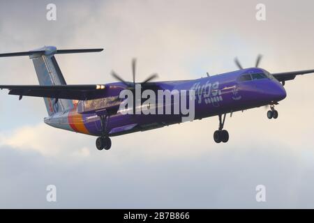 A De Havilland Bombardier operated by Flybe, making a final approach at Leeds Bradford International Airport Stock Photo