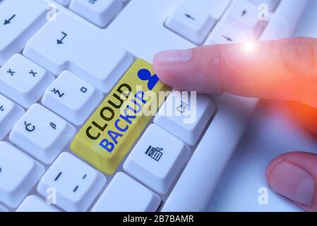 Word writing text Cloud Backup. Business photo showcasing enable customers to remotely access the provider s is services Stock Photo