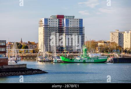 Green lightship Mary Mouse 2 moored at the entrance to Haslar Marina in Portsmouth Harbour viewed from Old Portsmouth, Hampshire, south coast England Stock Photo