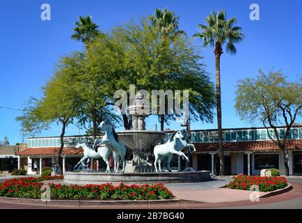 The landmark of Bronze horses and water fountain, a Scottsdale Public Art display depicts rearing Arabian horse sculptures in Old town Scottsdale, AZ Stock Photo