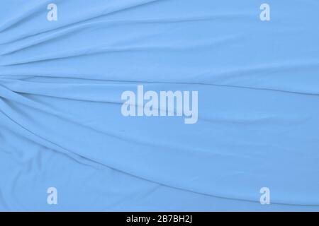 Top down view of flowing baby blue fabric. Stock Photo