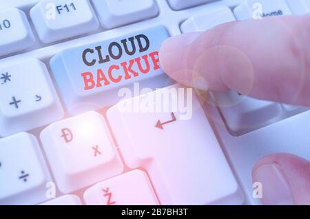 Word writing text Cloud Backup. Business photo showcasing enable customers to remotely access the provider s is services Stock Photo