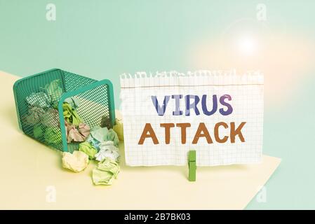 Handwriting text writing Virus Attack. Conceptual photo malicious program that perform actions unauthorized by the user Trash bin crumpled paper cloth Stock Photo