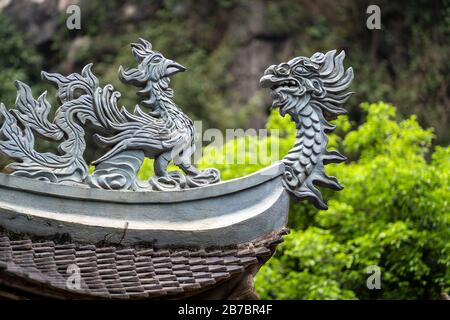 Beautiful dragon sculpture in buddhist temple in Trang An, Ninh Binh, Vietnam. Close up Stock Photo