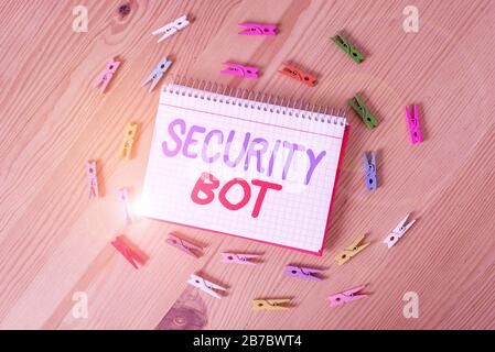 Handwriting text writing Security Bot. Conceptual photo software that performs an automated task over the Internet Colored clothespin papers empty rem Stock Photo