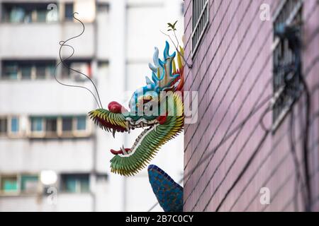 Dragons and mythical animals as decoration commonly seen on roof of Chinese temples around Asia Stock Photo