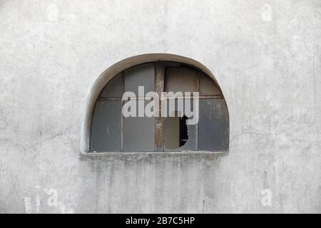 Broken window in an old building in Verona, Italy Stock Photo