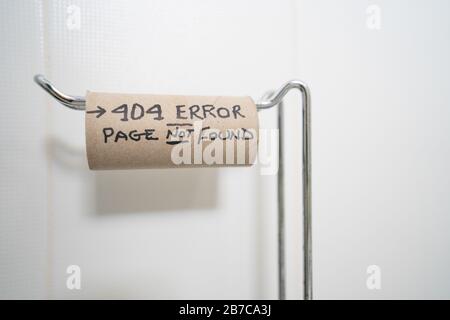 An empty toilet roll on a stand with the wording 404 error page not found,a humourous analogy of the Coronoavirus pandemic 2020 Stock Photo