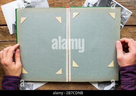 man looking photo album with old photos Stock Photo