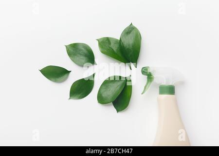 Eco spray bottle for safety cleaning, green leaves Stock Photo