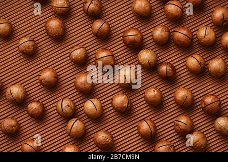 fresh macadam nut close-up on a brown background Stock Photo