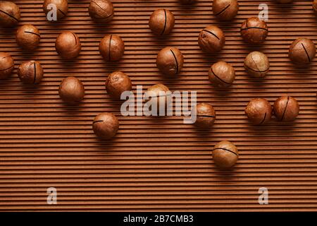 fresh macadam nut close-up on a brown background Stock Photo
