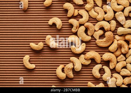 fresh cashew nuts close-up on a brown background Stock Photo