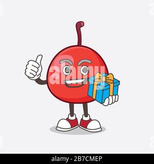 A picture of Red Berry cartoon mascot character with gift Stock Photo