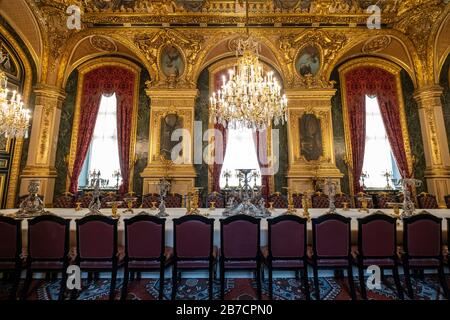 Large Dining Room with chandeliers and long table in Napoleon III Apartments at the Louvre museum in Paris, France, Europe Stock Photo