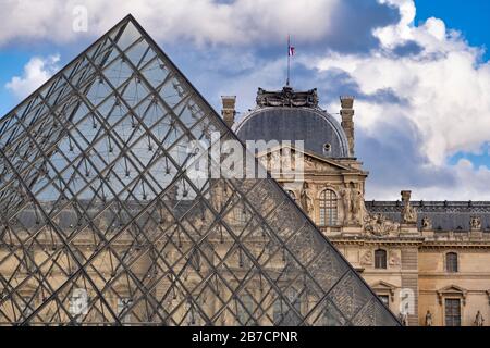 The Louvre Museum and the glass pyramid in Paris, France, Europe