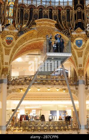 Tourists taking photos on the glasswalk hanging over the atrium of the Galeries Lafayette Paris Haussmann department store in Paris, France, Europe Stock Photo