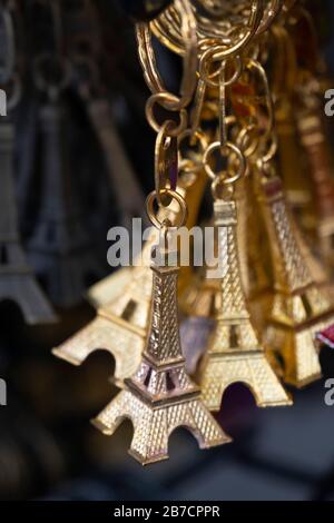 Miniature Eiffel Tower metallic key-chains Paris souvenirs for sale Stock Photo