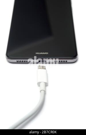Huawei smartphone with USB Type C charging cable Stock Photo