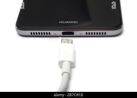 Huawei smartphone with USB Type C charging cable Stock Photo