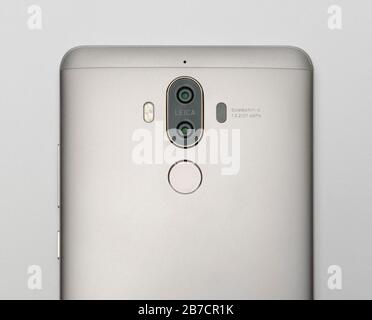 Rear view of a smartphone with dual camera lenses and a fingerprint scanner Stock Photo