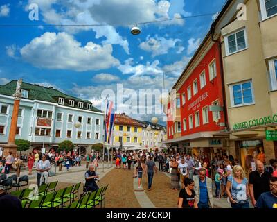 Lienz, Austria - August 2019: People strolling in the colorful streets of the cozy city of Lienz Stock Photo